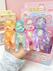 Set of four colorful glitter filled maltose squeeze baby toys in pastel colors