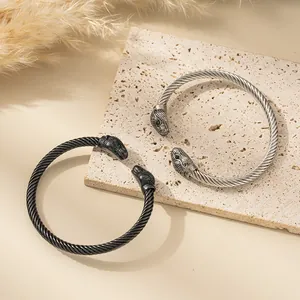 Men's stainless steel cable bracelet with crystal leopard head and green gemstone eyes