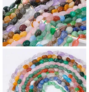 Macro shot of irregular polished amethyst and aquamarine natural gemstone spacer beads
