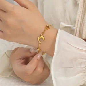 Elegant gold titanium steel bracelet for women featuring delicate moon and star charms