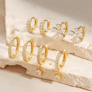 Elegant gold plated flower and zircon hoop earring set for women on natural stone