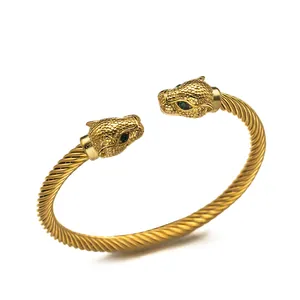 Mens gold stainless steel twisted cable bracelet with emerald-eyed leopard heads
