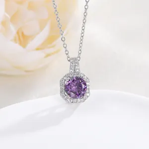 Macro detail of silver necklace featuring an octagonal pendant with purple zircon