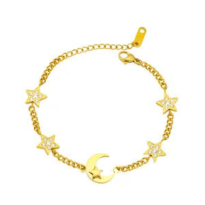 Close-up of gold titanium steel bracelet with zircon stars and moon pendants