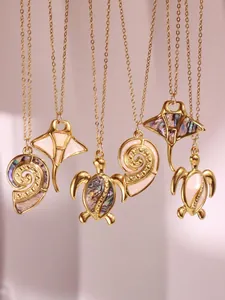 Detailed macro view of marine series pendants with sea turtle and shell shell inlays