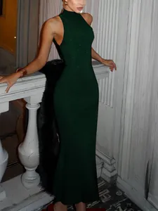 Detail of dark green mermaid evening dress with sparkling rhinestones and high neck
