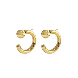 Minimalist gold geometric C-shaped hoop earrings with polished metal bead detail for women