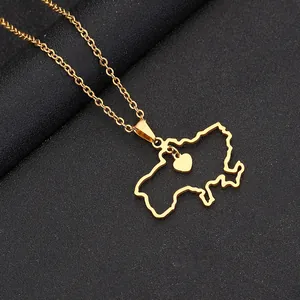 Macro shot of gold stainless steel Ukraine map pendant with heart charm on black leather