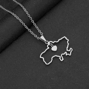 Detail of silver Ukraine map pendant with small heart on a stainless steel chain