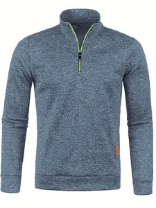 Front view of men's blue heathered knit sweater with a lime green half-zip detail.