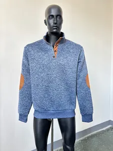 Detail view of men's blue heathered mock neck sweatshirt with brown elbow patches