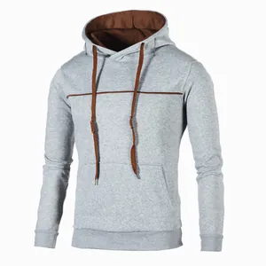 Detailed view of a grey men's slim-fit hoodie with brown piping and brown hood lining