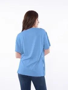 Back view of light blue chemo shirt with functional side snap buttons for port access.