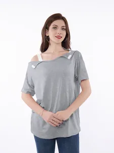 Woman wearing a grey chemo shirt with shoulder port access tabs for medical care