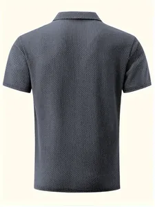 Back view of a grey short-sleeve polo shirt with waffle knit texture and classic collar.