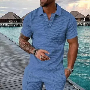 Detailed view of blue men's polo shirt with 3D geometric texture in resort setting