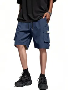 Men's loose dark blue cargo shorts with multiple utility pockets and drawstring waist