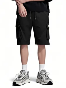 Detailed shot of men's black loose-fit cargo shorts featuring side pockets and drawstring