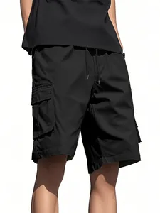 Detail view of black cargo shorts featuring a multi-pocket design and drawstring waist.