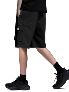Side view of men's loose black cargo shorts with multiple pockets and tag detail