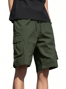 Close-up view of men's olive green cargo shorts featuring functional side pockets.
