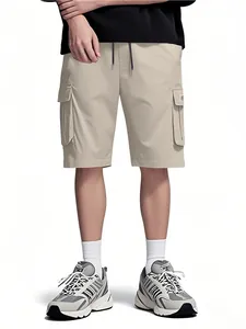 Detailed view of men's beige summer cargo shorts featuring side pockets and drawstring
