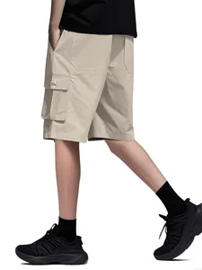 Side detail of men's loose khaki cargo shorts with functional multi-pocket design