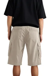 Back view of men's loose khaki cargo shorts featuring functional multi-pocket details
