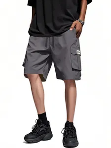 Detailed view of men's loose cargo shorts with multiple pockets and drawstring waist.