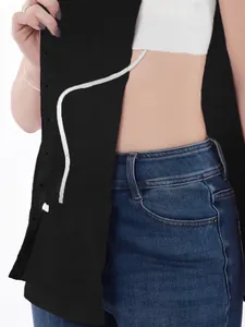 Detail view of post-surgery recovery shirt with side snaps for medical tube access