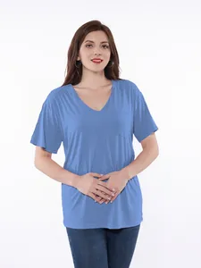 Detailed front view of a light blue V-neck recovery shirt worn by a female model on white