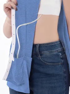 Detail view of unisex post-surgery recovery shirt with snap buttons and medical tube pocket