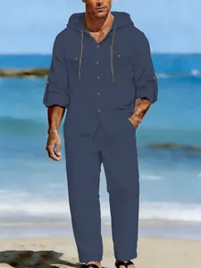 Detailed view of men's navy blue linen casual two-piece hooded set on the beach