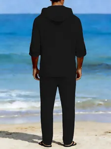 Full back view of men's black linen hooded top and long pants casual beach set