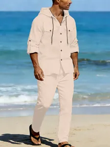 Detailed view of a men's beige linen hooded long-sleeve shirt and matching trousers set