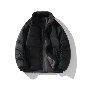 Detailed view of a classic black unisex winter puffer jacket featuring a stand-up collar