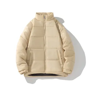 Detail view of unisex beige quilted puffer jacket featuring stand-up collar and zip