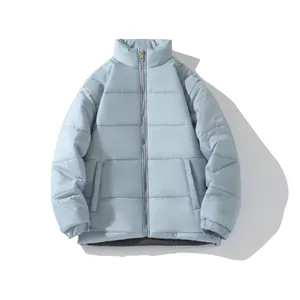 Detailed view of a light blue unisex winter puffer jacket with a padded stand-up collar.