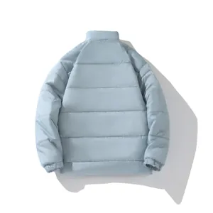 Back view of a stylish light blue quilted winter puffer jacket with a high collar.