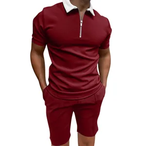 Detail of men's burgundy casual polo shirt with white zipper collar and matching shorts set