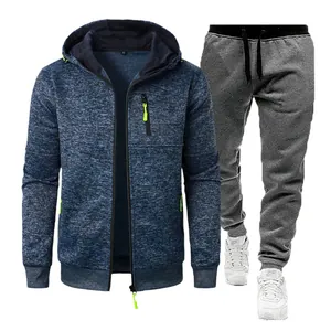 Close-up of men's textured zip-up hoodie and grey sweatpants with lime accents