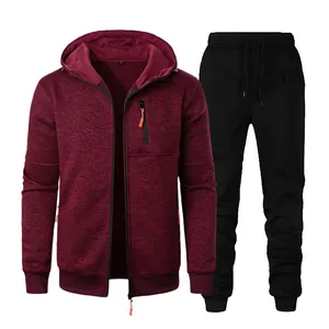 Detailed view of men's burgundy hooded jacket and black sweatpants set