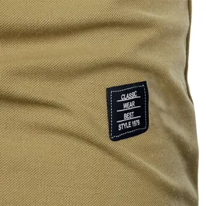 Close-up detail of khaki pique fabric and embroidered Classic Wear patch on men's polo shirt