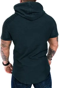 Close-up detail of men's dark green hooded t-shirt with slub texture and pleated sleeves