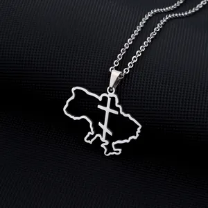 Detailed close-up of Ukraine map pendant with cutout cross in silver steel