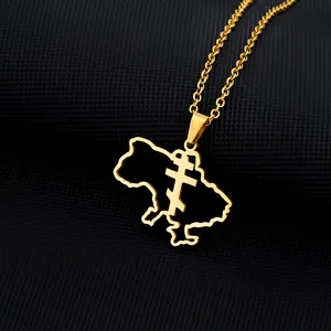 Macro detail of gold stainless steel Ukraine map pendant with Orthodox cross