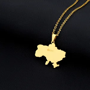 Detailed close-up of gold Ukraine map pendant with Kyiv engraving on cross chain