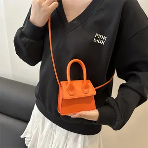 Mini vibrant orange crossbody handbag with top handle for women's trendy daily wear