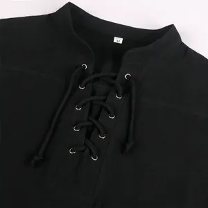 Detail of men's medieval renaissance black shirt with lace-up bandage front and eyelets.