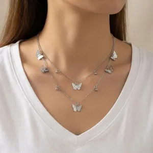 Elegant double-layered silver butterfly necklace with multiple dainty butterfly pendants